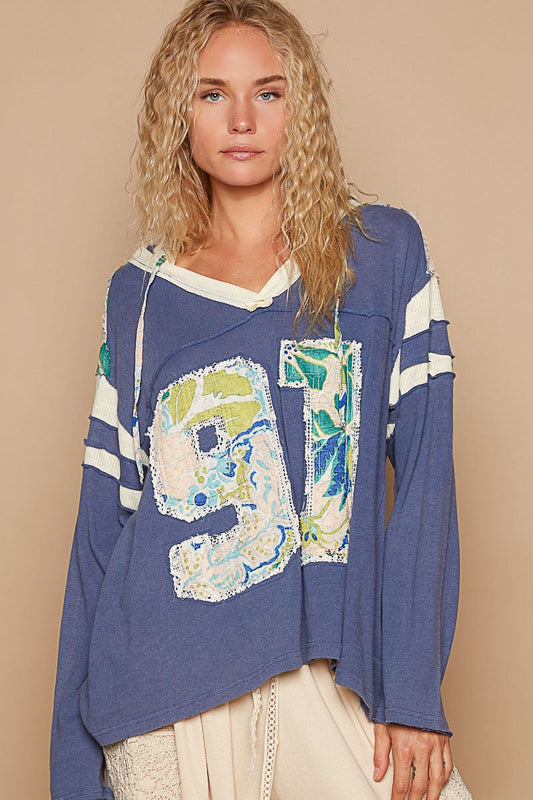 Benita | POL hooded top with exposed seam and number patch and V-neck