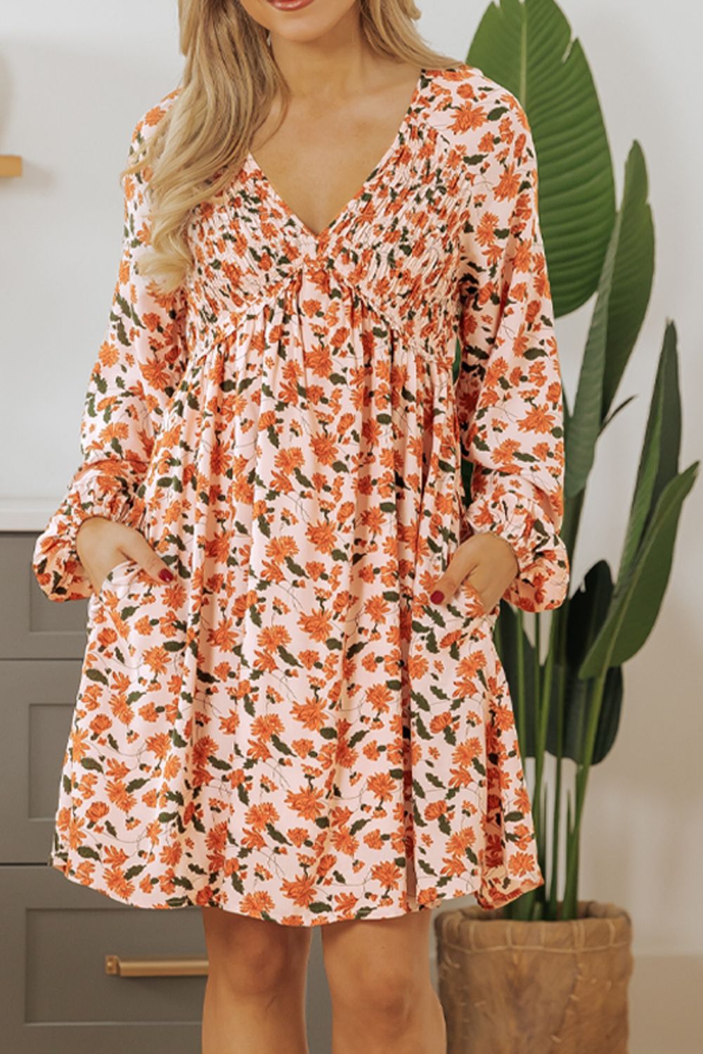 Amparo® | Smocked printed long sleeve dress with V-neck