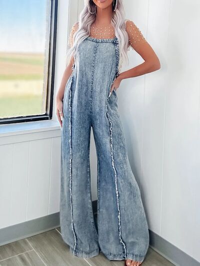 Carina® | Wide leg denim jumpsuit with exposed seams