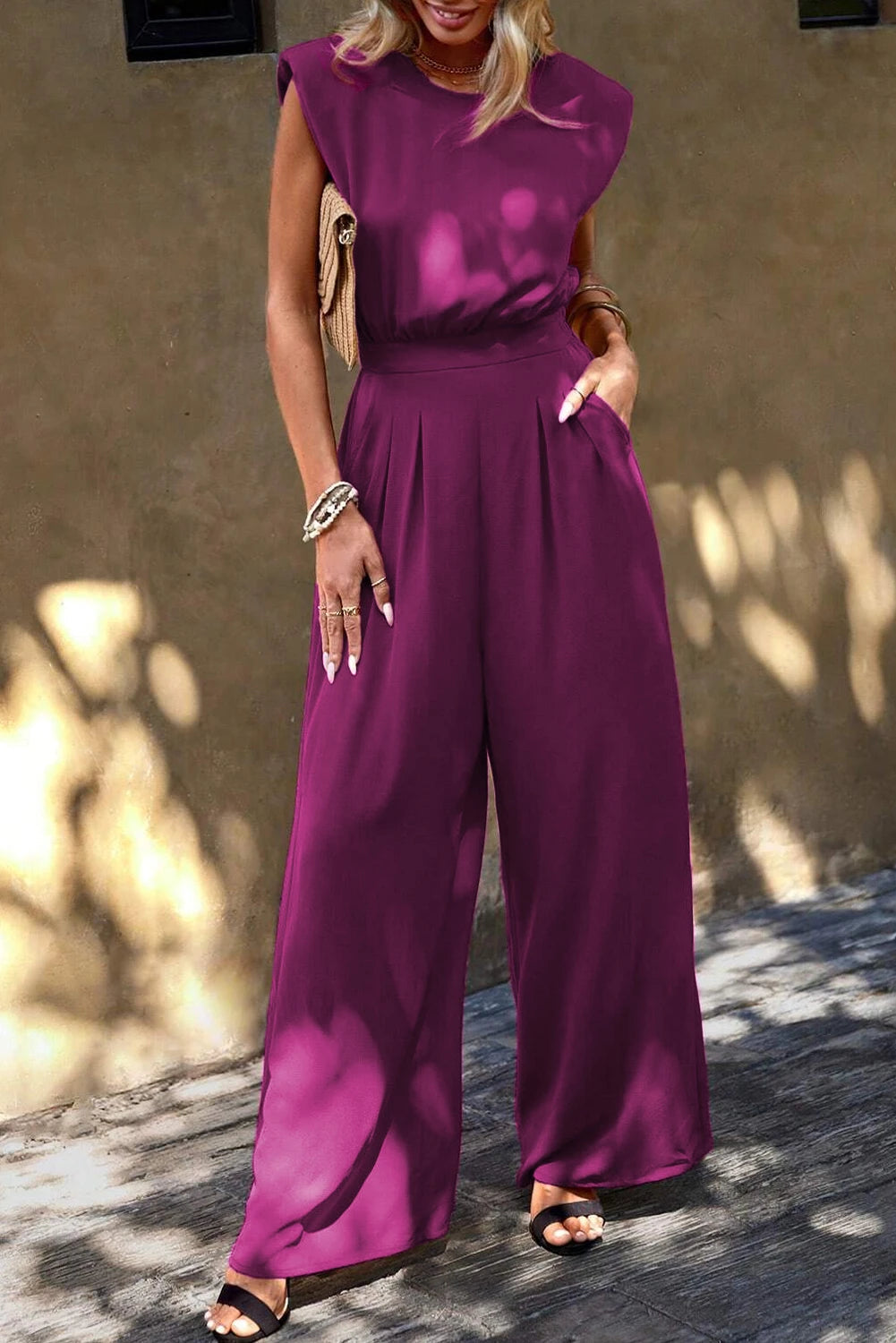 Elisa® | Pink jumpsuit with padded shoulders, slanted pockets and wide legs