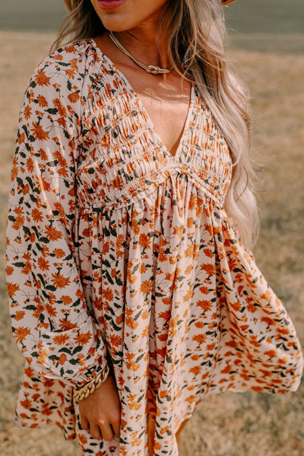 Amparo® | Smocked printed long sleeve dress with V-neck
