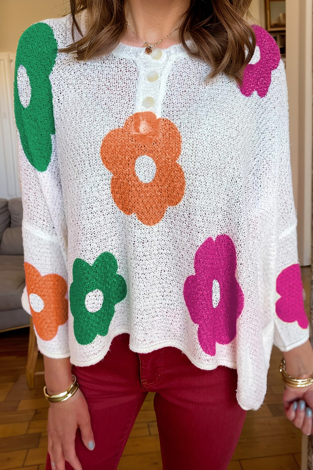 Delia® | Floral knit top with a crew neck and quarter buttons