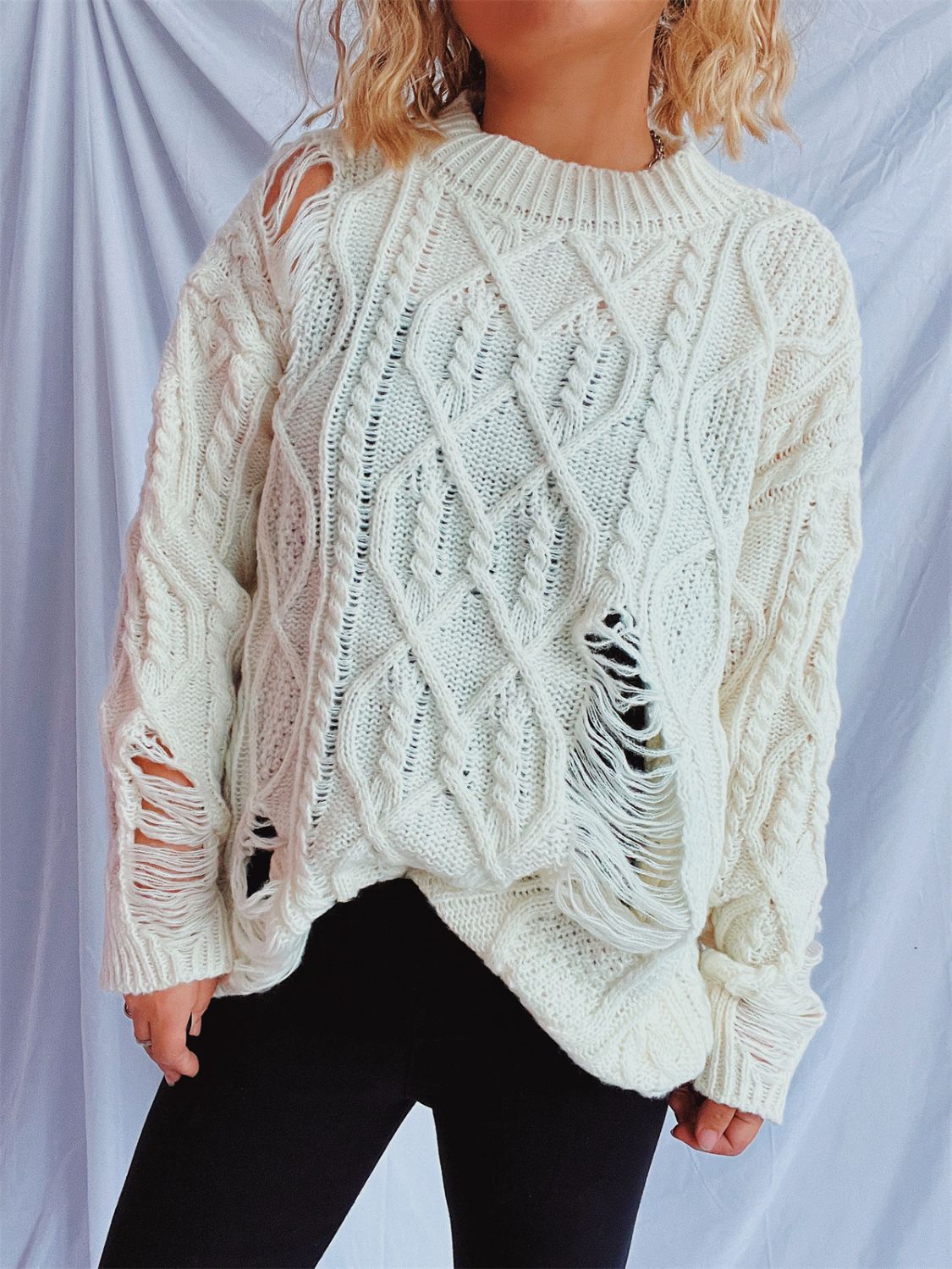 Clara® | Long-sleeved, crew-neck, distressed cable-knit sweater
