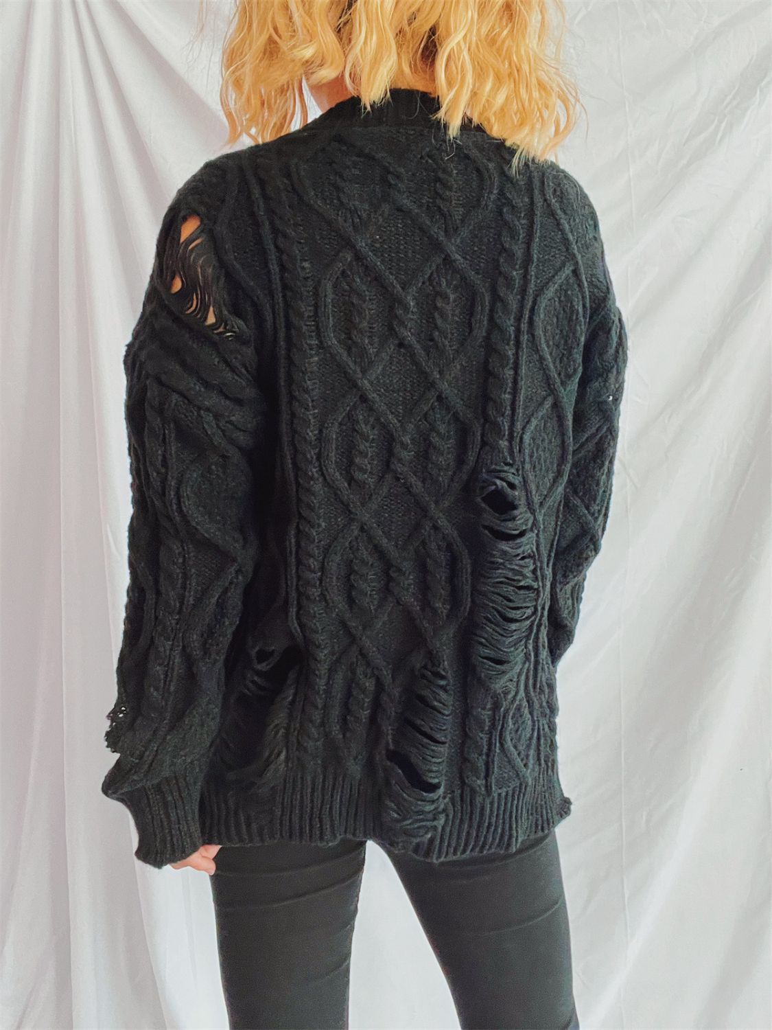 Clara® | Long-sleeved, crew-neck, distressed cable-knit sweater