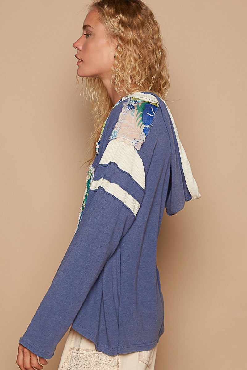 Benita | POL hooded top with exposed seam and number patch and V-neck