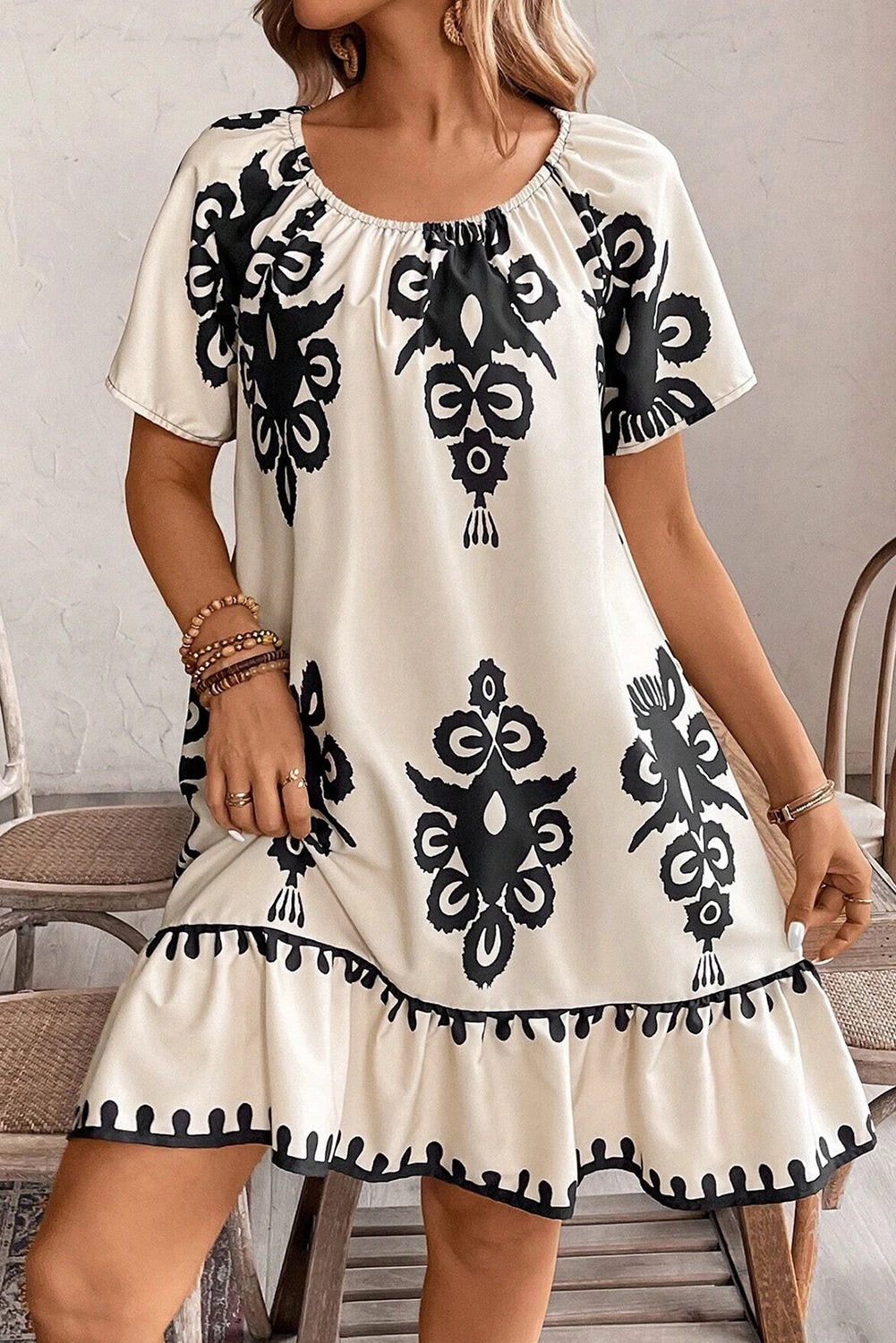 Dayana® | Apricot-colored, loose mini dress with ethnic print and ruffled hem