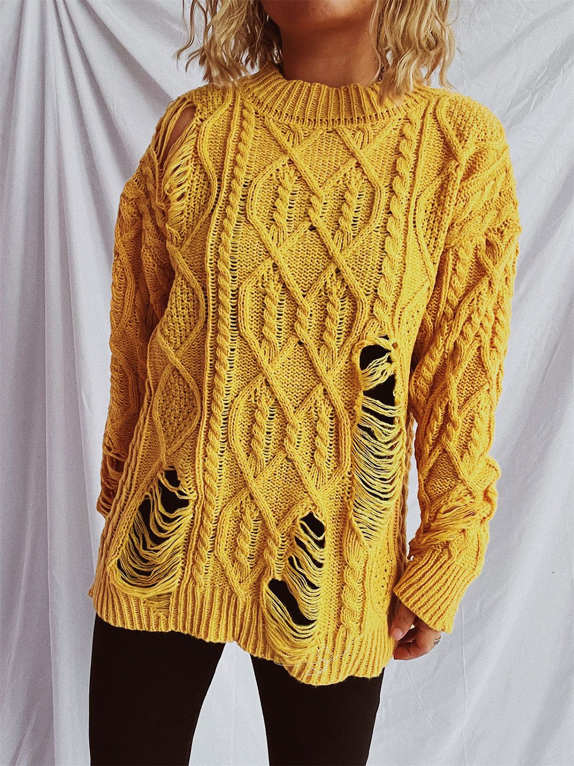 Clara® | Long-sleeved, crew-neck, distressed cable-knit sweater