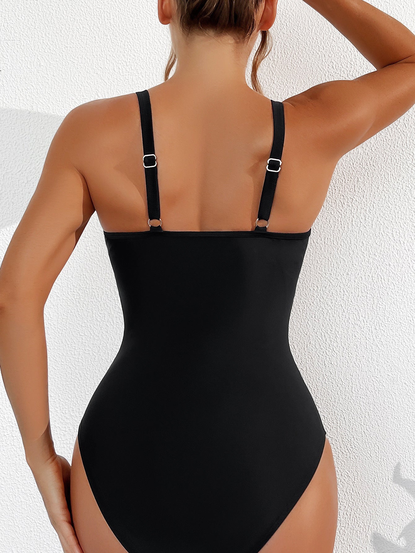 Calypso® | V-neck swimsuit with adjustable straps and sheer details